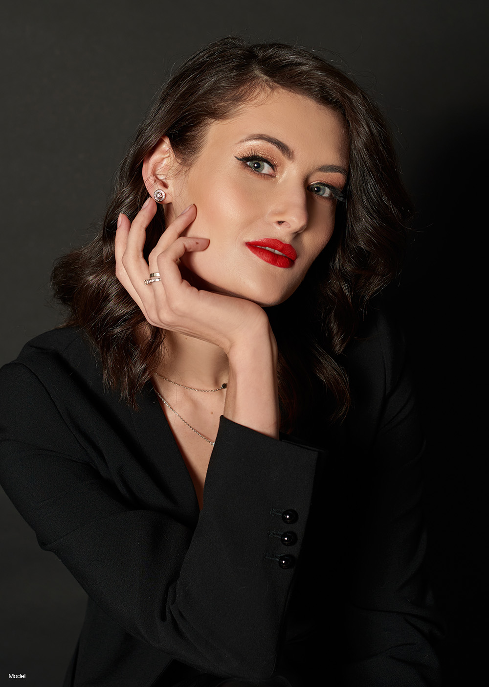 Woman wearing all black with lipstick
