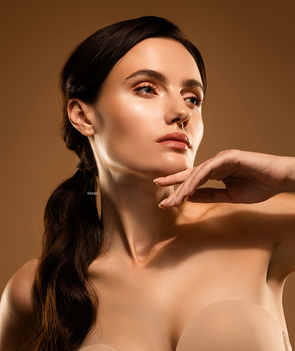 Woman touching her neck
