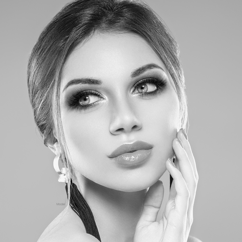 rhino-faq-model Beautiful woman touching her face